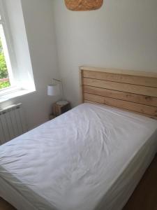 Postel nebo postele na pokoji v ubytování Ôdesmontagnes