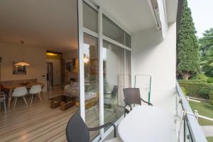 a living room and dining room of a house at Appartement Lago Blu in Riva del Garda