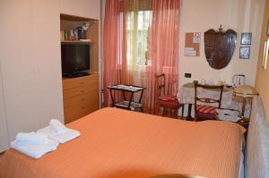 Postel nebo postele na pokoji v ubytování B&B Villa Olmo