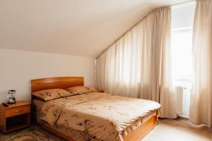מיטה או מיטות בחדר ב-Autentic Adorabil Apartment