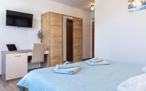Postel nebo postele na pokoji v ubytování Villa Umag Seafront