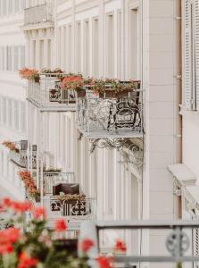 a building with flower boxes on the side of it at Kaiserhof Victoria in Bad Kissingen