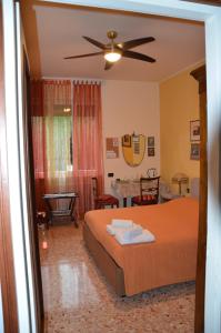 Postel nebo postele na pokoji v ubytování B&B Villa Olmo