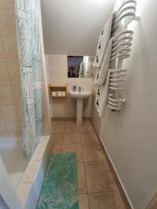 a bathroom with a sink and a shower and a toilet at Siedlisko nad Sapiną in Kruklanki +34 photos