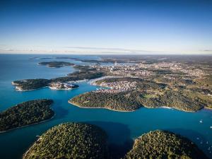 an aerial view of a group of islands in the water at Krajcer Apartments in Pula +10 photos