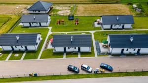 a model of a house with cars parked in a yard at Słoneczne Wzgórze Zator in Zator