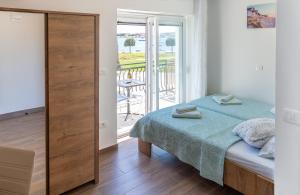 Postel nebo postele na pokoji v ubytování Villa Umag Seafront