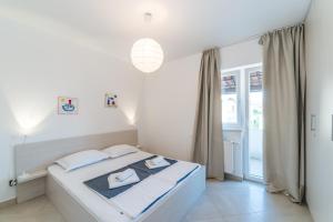Posteľ alebo postele v izbe v ubytovaní Apartments Keran