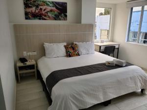 Postel nebo postele na pokoji v ubytování Hotel Cafeira