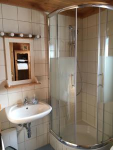 a bathroom with a sink and a shower at Berg Chalet 303 in Turracher Hohe