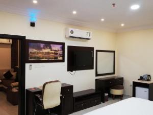 Un televizor și/sau centru de divertisment la Alsafa Hotel