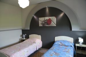 Una cama o camas en una habitación de B&B Rozafa