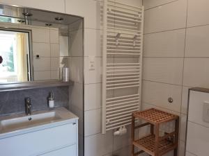 a bathroom with a sink and a mirror at Haus Pleterski in Obervellach