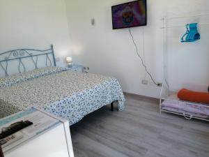 Voodi või voodid majutusasutuse Istentales Alghero toas