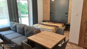 Ένα ή περισσότερα κρεβάτια σε δωμάτιο στο Apartament SZWED-POL