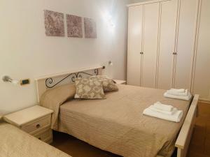 Postel nebo postele na pokoji v ubytování La collina su Ascoli