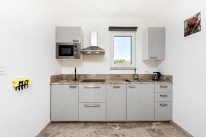 Kuchyň nebo kuchyňský kout v ubytování Apartment Apsyrtides