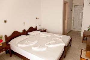 Postel nebo postele na pokoji v ubytování Anatoli Beach Hotel
