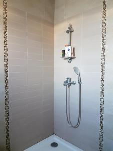 a shower in a bathroom with a toilet at Dar Doudi in Sousse