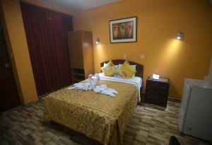 Postel nebo postele na pokoji v ubytování Hotel Suite Plaza