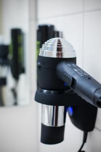 a close up of a hair dryer on a cup at LIHO - einfach Lübeck in Lübeck