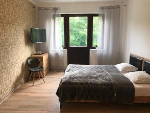 Ένα ή περισσότερα κρεβάτια σε δωμάτιο στο Loft Wisla Houses