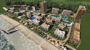 a model of a resort on a beach next to the water at Dreamland Oasis of happiness in Chakvi