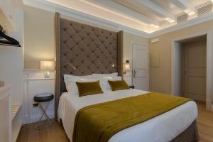 A bed or beds in a room at Boutique Hotel Villa Zoppi - Adults only