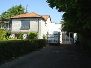 a rv parked in front of a house at 2 room apartment in Ystad