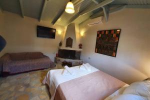 A bed or beds in a room at Villa Aliki