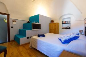 Posteľ alebo postele v izbe v ubytovaní Arvé Castelbianco - B&B e Appartamento