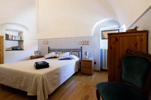 Posteľ alebo postele v izbe v ubytovaní Arvé Castelbianco - B&B e Appartamento