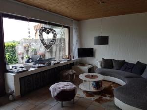 a living room with a couch and a window at HideOut in Monschau