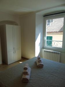 A bed or beds in a room at Affittacamere SveMilla