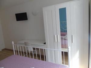 A bed or beds in a room at Affittacamere SveMilla