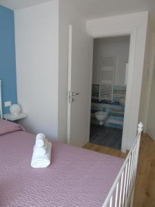 A bed or beds in a room at Affittacamere SveMilla