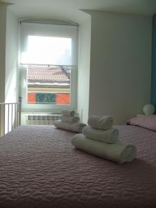 A bed or beds in a room at Affittacamere SveMilla