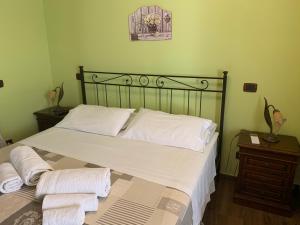 Postel nebo postele na pokoji v ubytování Agriturismo Torre Ercolana