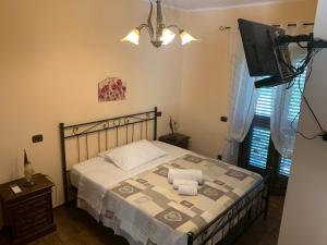 Postel nebo postele na pokoji v ubytování Agriturismo Torre Ercolana