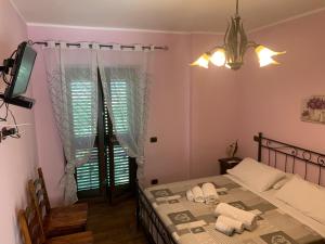 Postel nebo postele na pokoji v ubytování Agriturismo Torre Ercolana