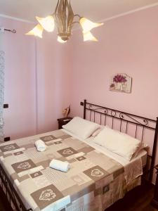 Postel nebo postele na pokoji v ubytování Agriturismo Torre Ercolana