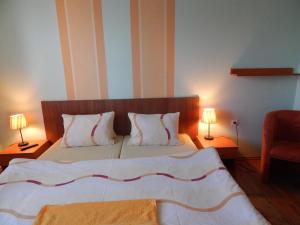 Posteľ alebo postele v izbe v ubytovaní RUBIN