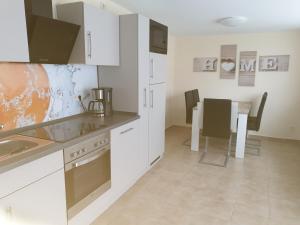 Kuchyň nebo kuchyňský kout v ubytování Ferienwohnung Sandra