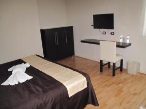 Postel nebo postele na pokoji v ubytování Hotel Granada