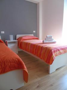A bed or beds in a room at Affittacamere SveMilla