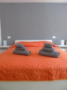 A bed or beds in a room at Affittacamere SveMilla