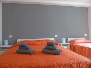 A bed or beds in a room at Affittacamere SveMilla