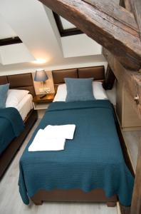 
Cama o camas de una habitación en U Medvidku-Brewery Hotel
