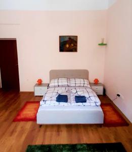 Postel nebo postele na pokoji v ubytování Gala Apartment