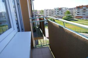 a balcony with a view of a city at Apartament w centrum Helu in Hel